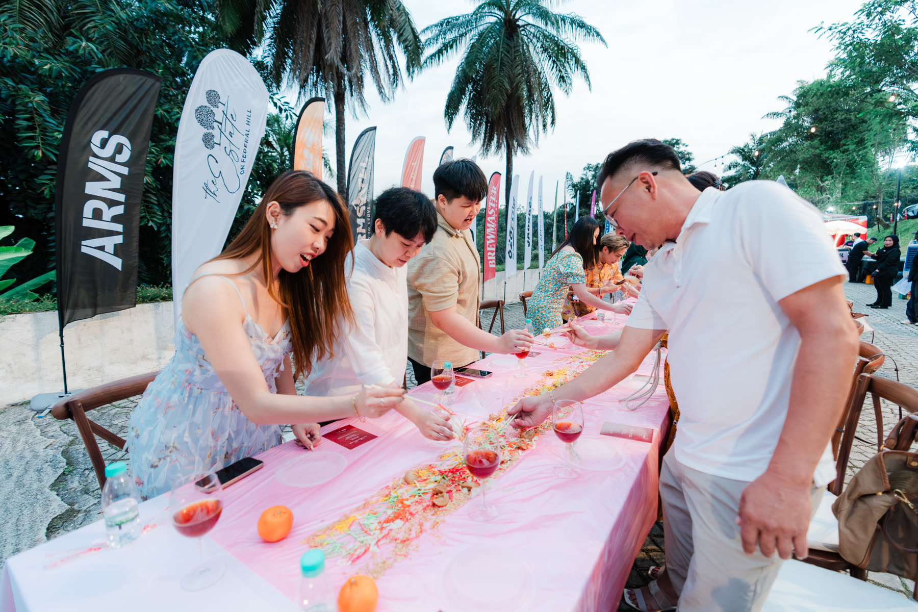 One long table, everybody reaching