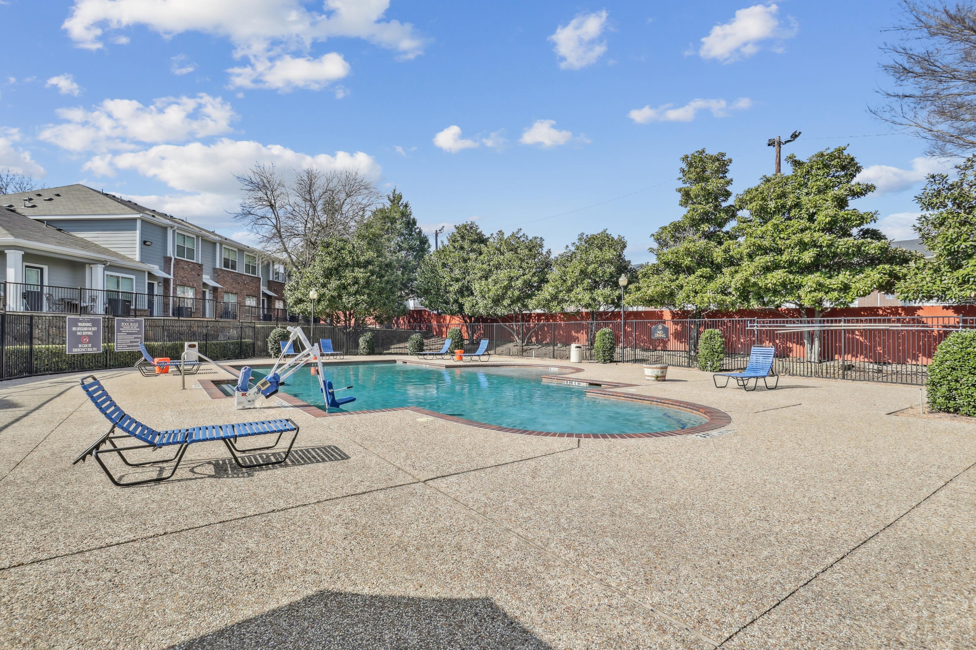 Pool deck with seating and large swimming pool