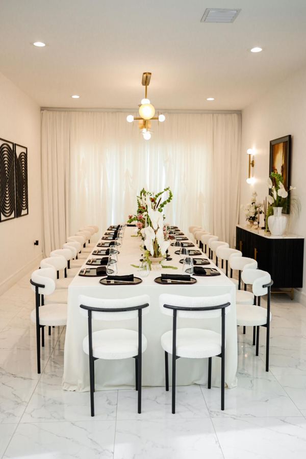 Modern black and white dinner tablescape by POSH Rentals