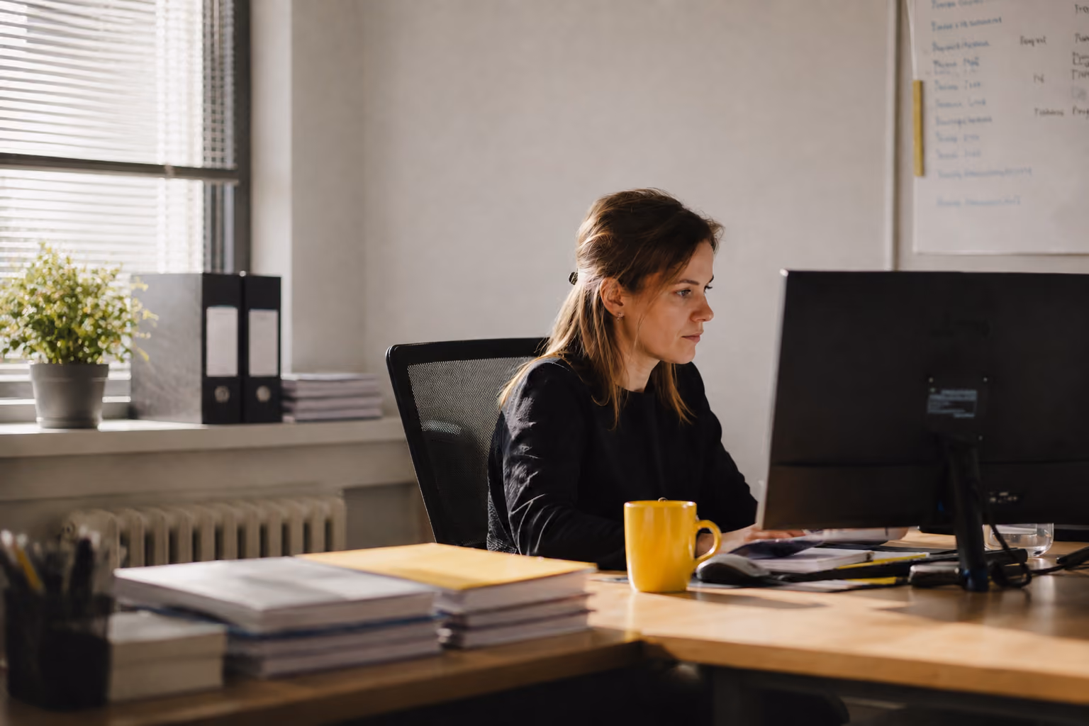 Patient team member working at a desk