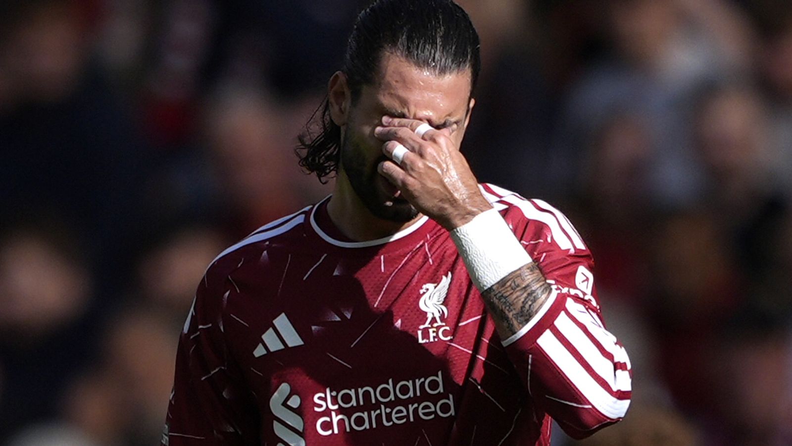 Dominik Szoboszlai wipes his face in frustration during Liverpool's goalless draw with Fulham at Anfield