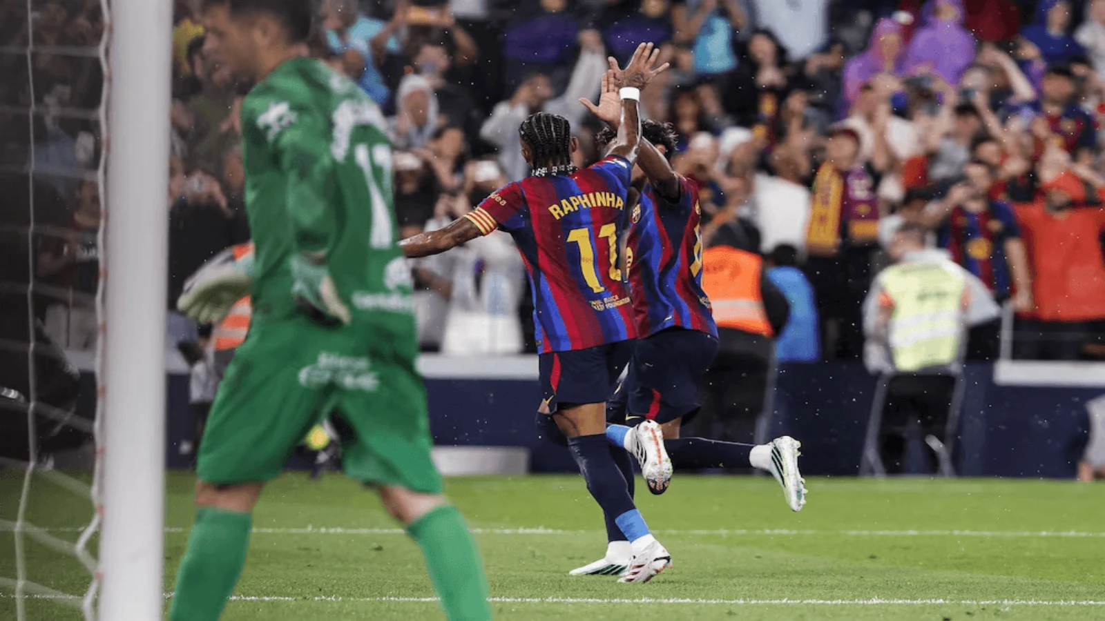 Raphinha and Lamine Yamal after scoring a goal v Santander