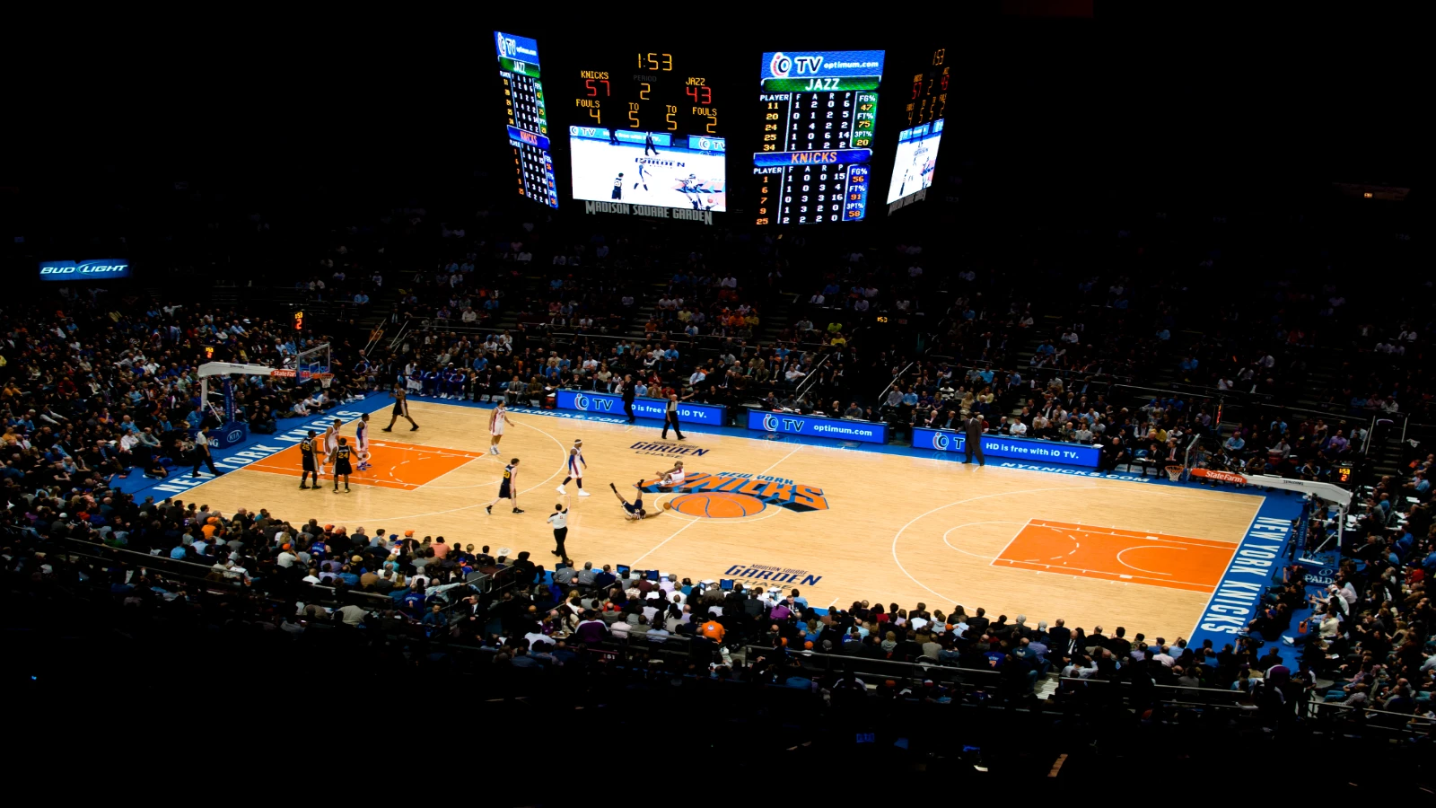 Madison Square Garden during a New York Knicks home game against the Utah Jazz in 2011, seen from the upper tier with the scoreboard above center court.