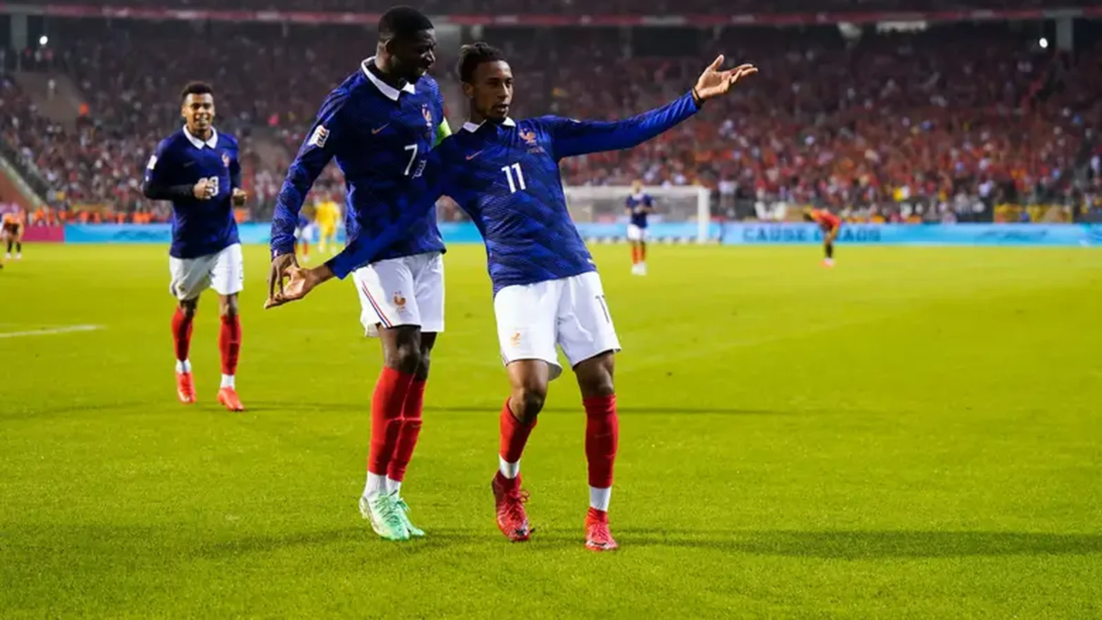 Michael Olise celebrating a goal against Belgium