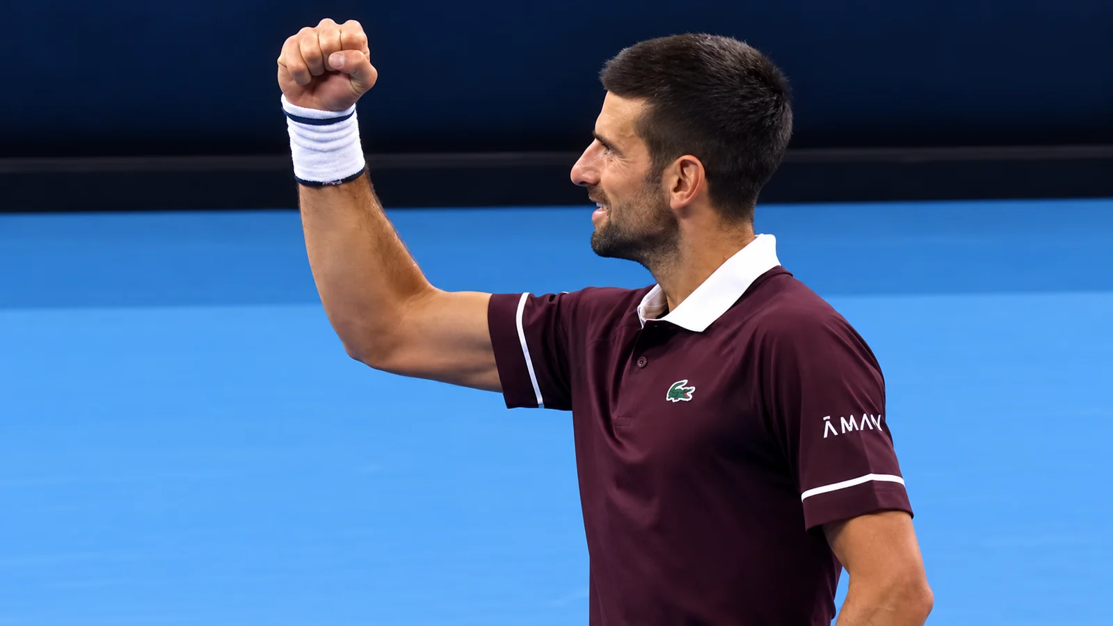 Novak Djokovic raises his fist in celebration after defeating Alexander Zverev at the China Open in Beijing.