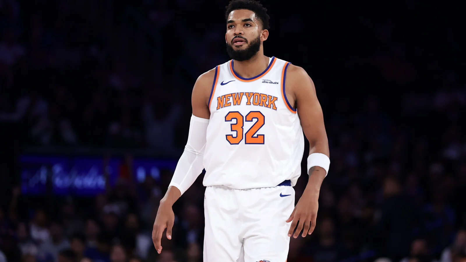 Karl-Anthony Towns stands on the court in a New York Knicks uniform during a game.