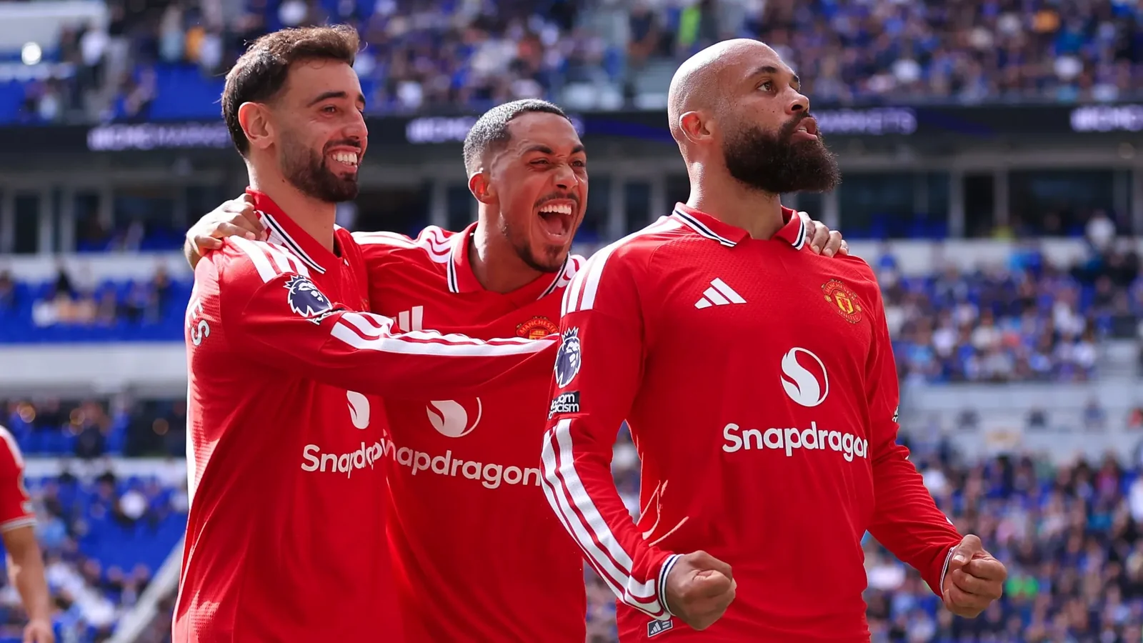 Manchester United players celebrate together during a Premier League match.