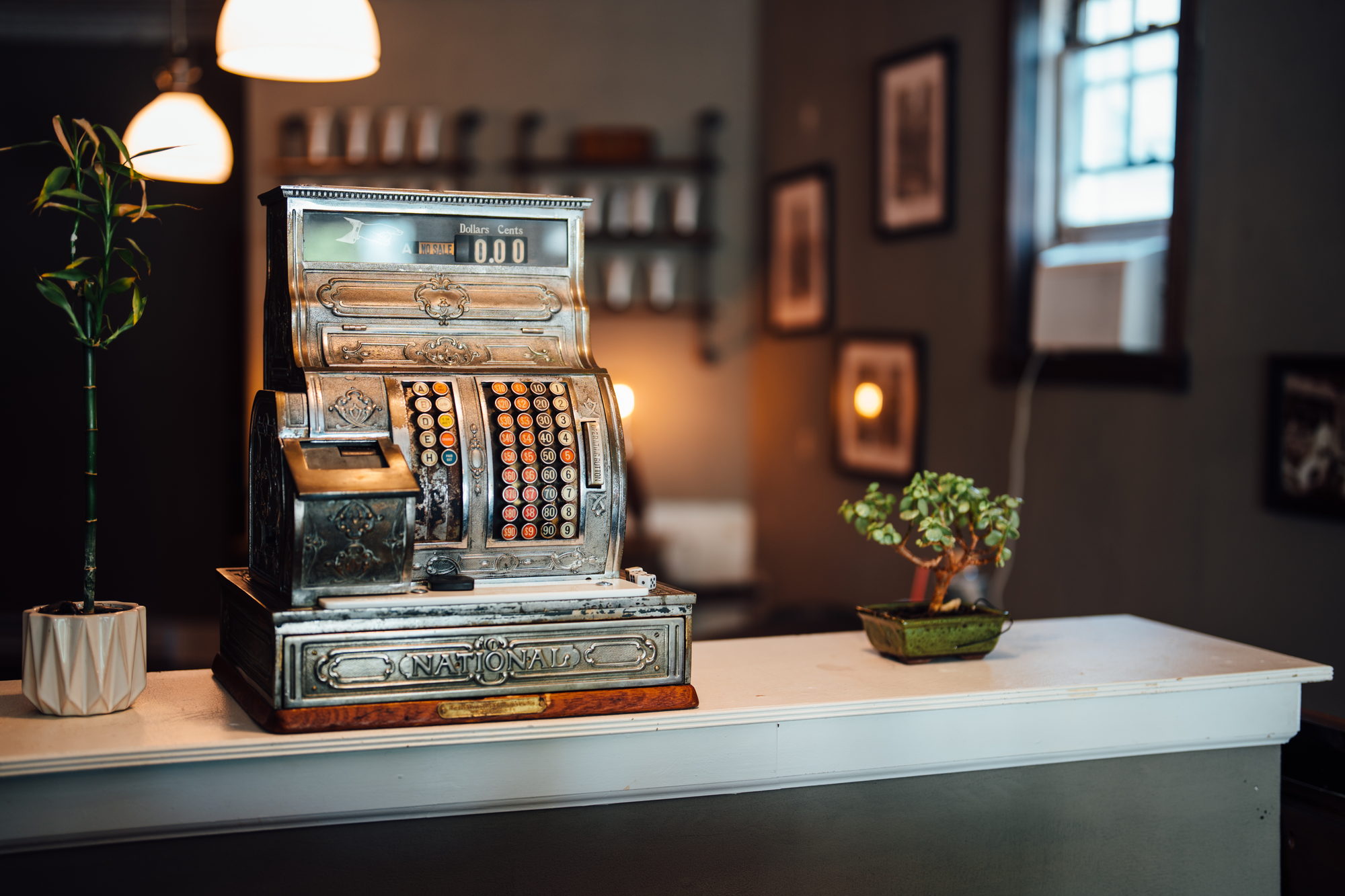 An antique National cash register on the front counter at The Stray Hare