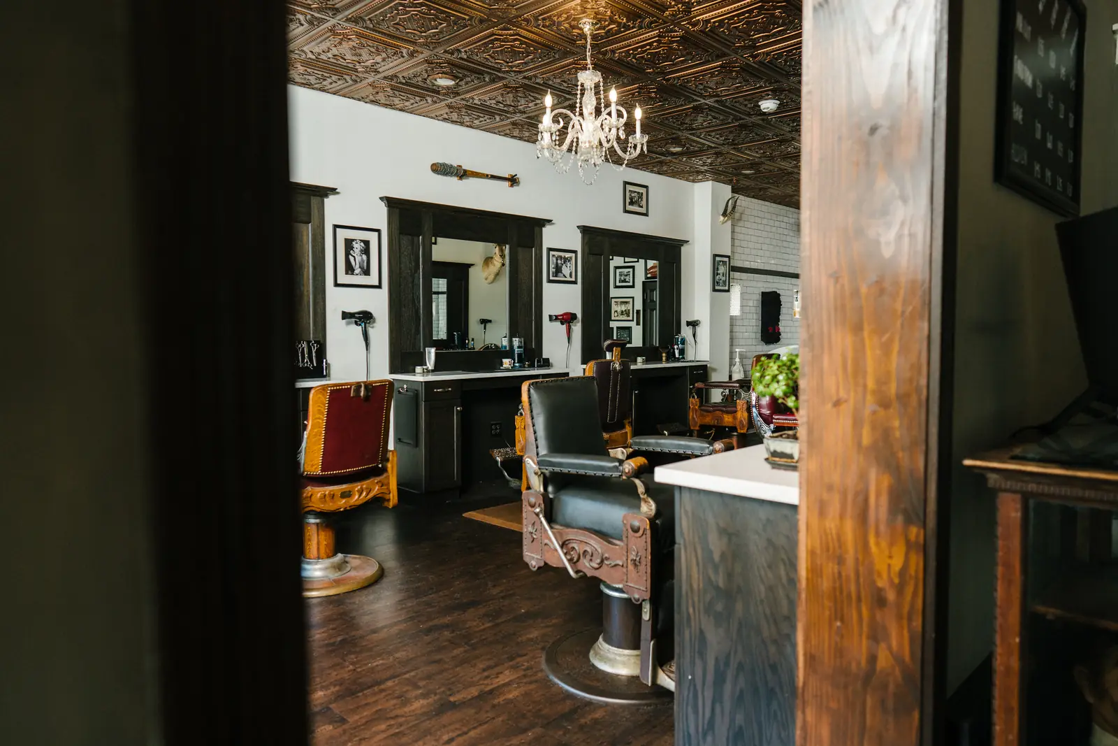 Antique barber chairs and stations on the shop floor at The Stray Hare in Waldwick