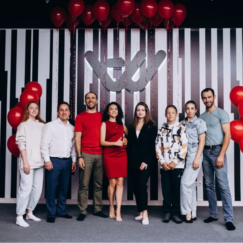A company team celebrating at Another World VR North York