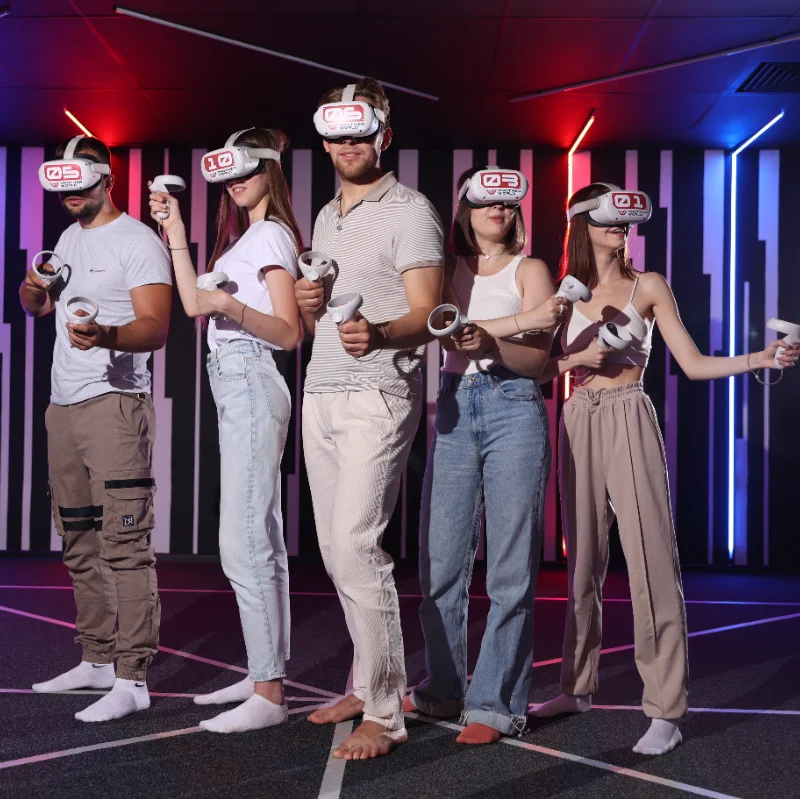 A work team playing free-roam VR together at Another World VR North York