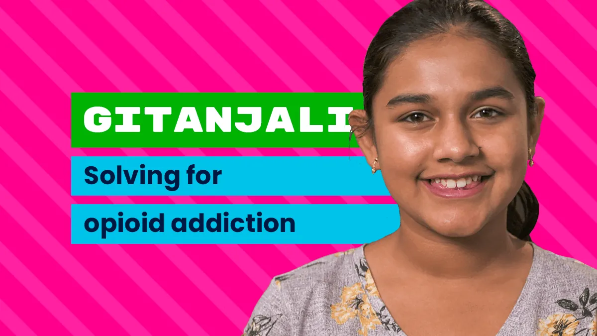 A young American/South Asian woman smiling, on a bright pink background with the words "Gitanjali, solving for opioid addiction"