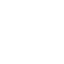 Front view of a silver semi-truck with twin vertical exhaust pipes and large grille.
