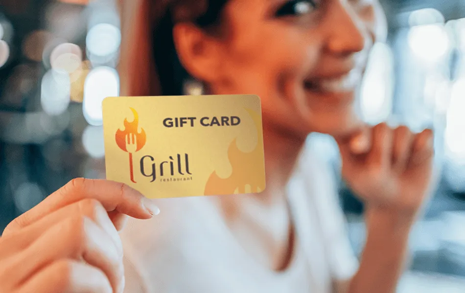 Customer holding a branded restaurant gift card