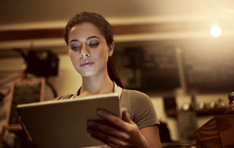 Operator reading end of service reports on a tablet