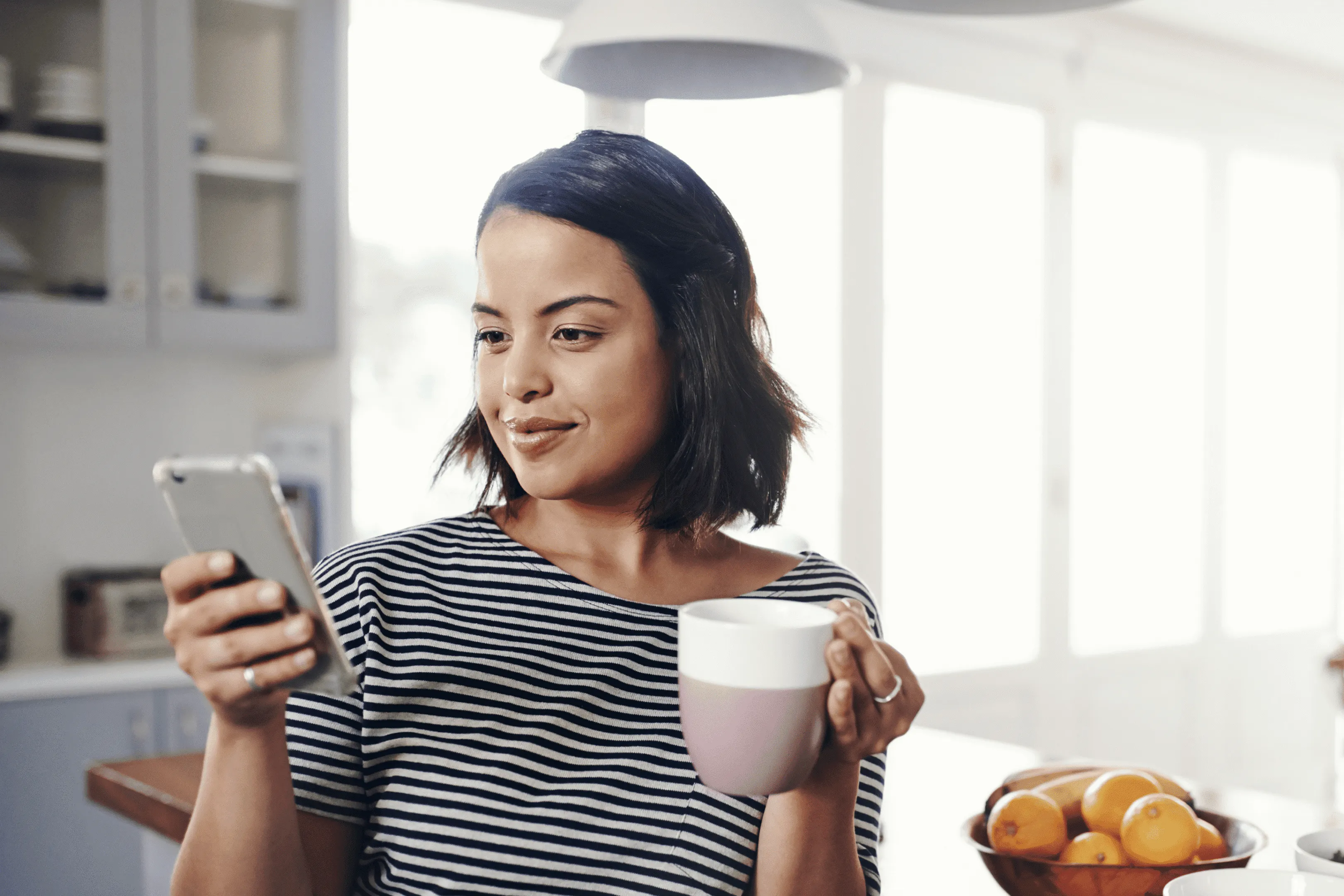 Customer placing an online order on her phone at home
