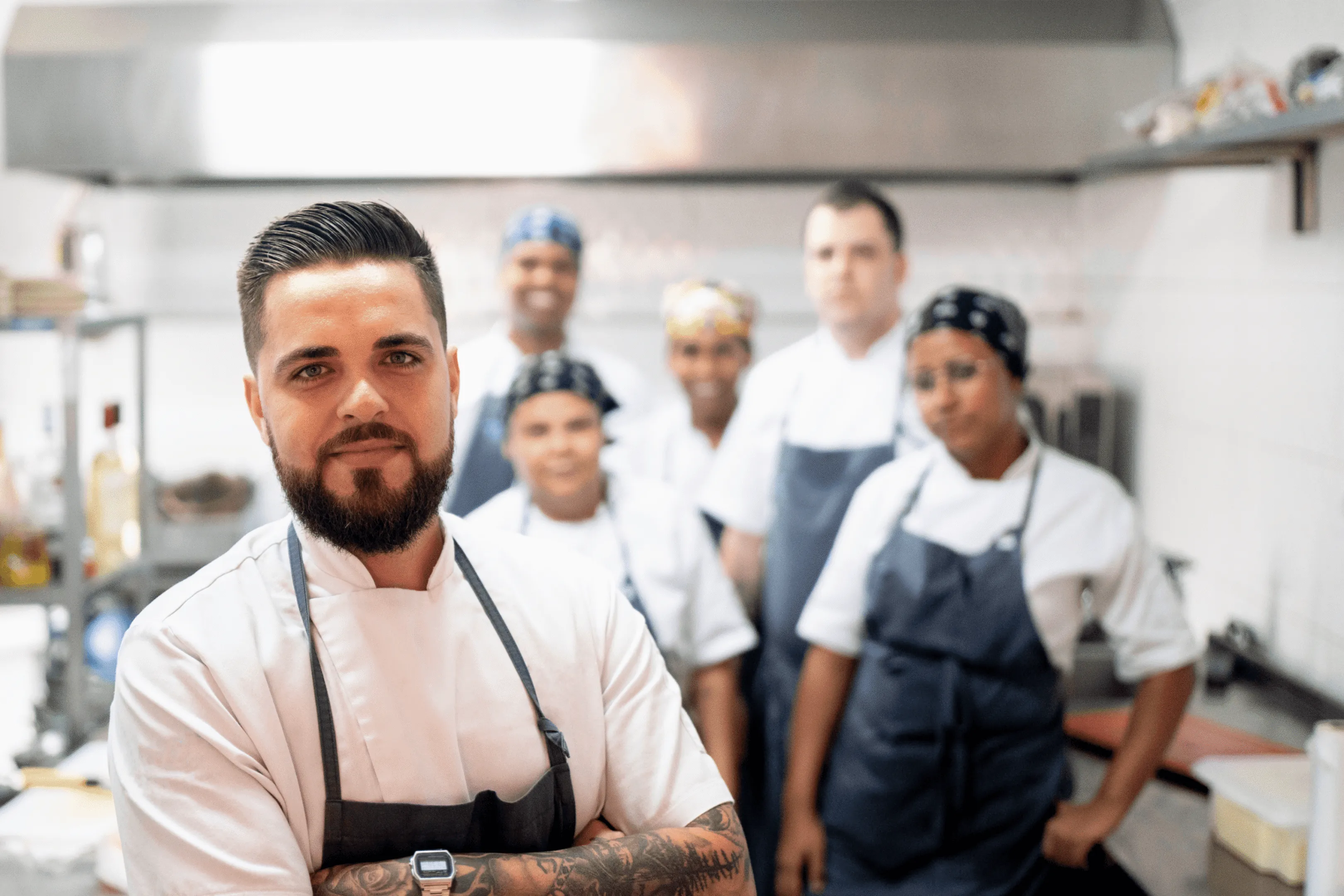 Kitchen brigade lined up in front of the pass