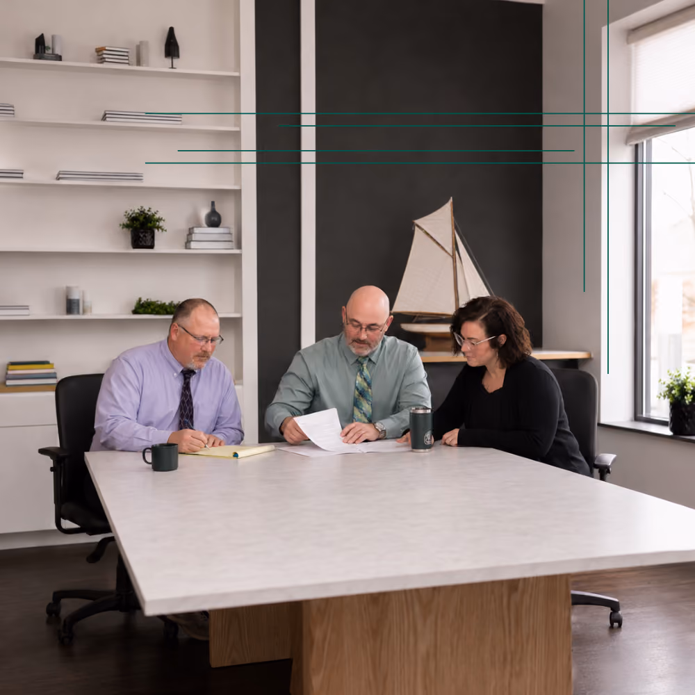 Barrett Financial Team working collaboratively on a project.
