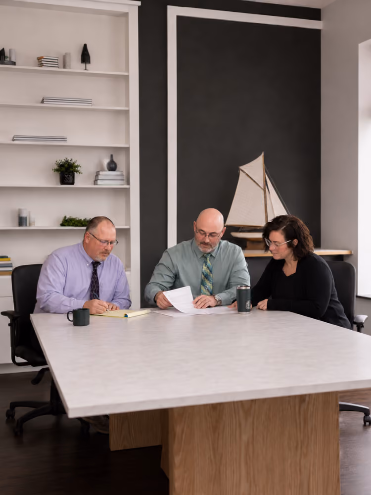 Barrett Financial Staff Collaboratively Working On A Tax Return.