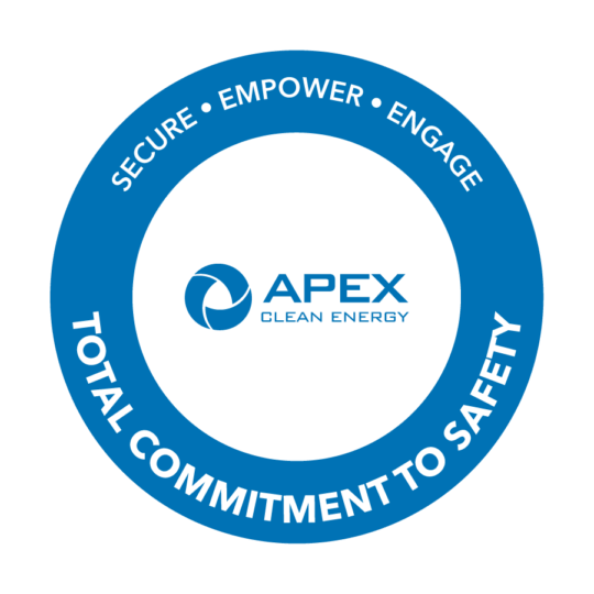 Apex Clean Energy logo with the text Secure, Empower, Engage, and Total Commitment to Safety in a blue circle.
