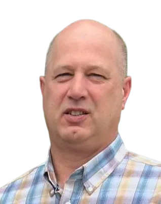 Middle-aged man with short hair wearing a plaid shirt, looking slightly right of the camera.