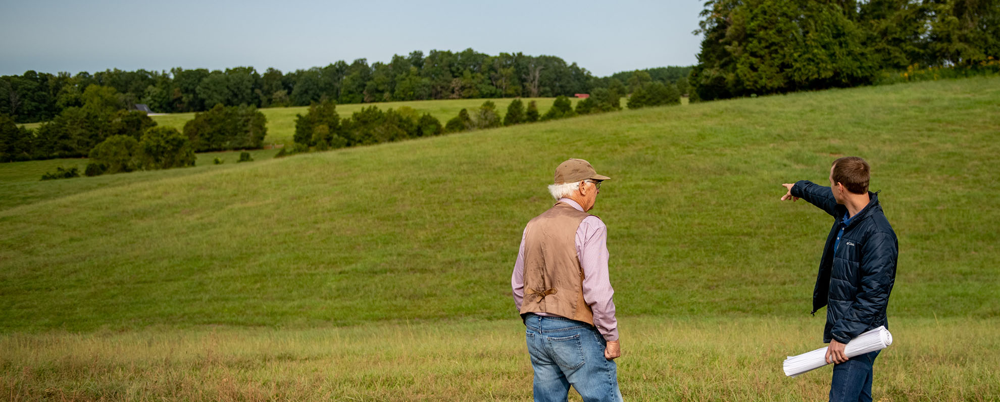 Developer with landowner reviewing property