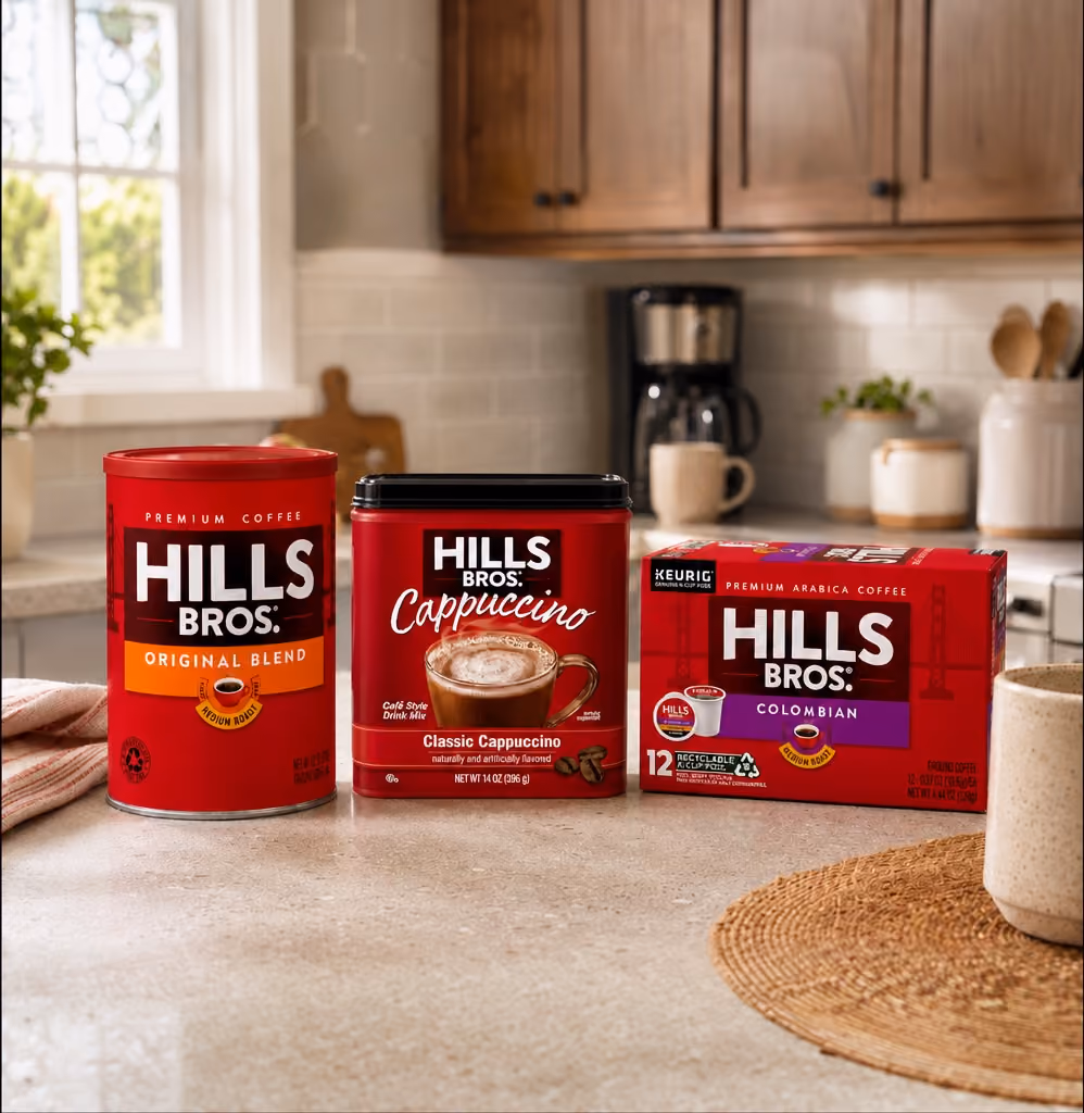 Hills Bros. coffee cans and cappuccino tins on a kitchen counter
