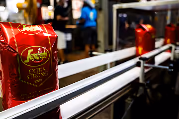 Segafredo coffee bags moving along a production line