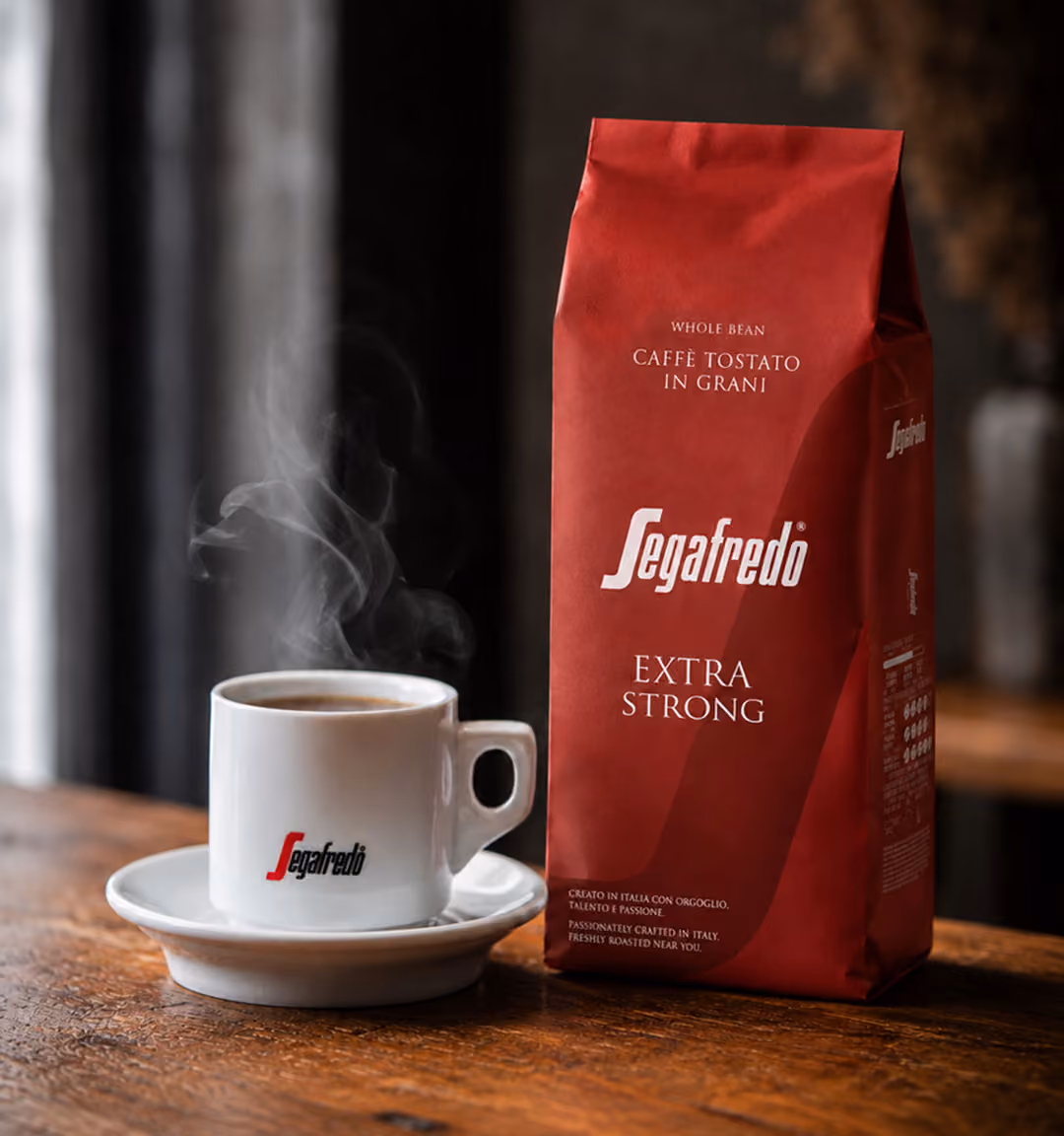 Segafredo espresso cup and saucer on a wooden cafe table