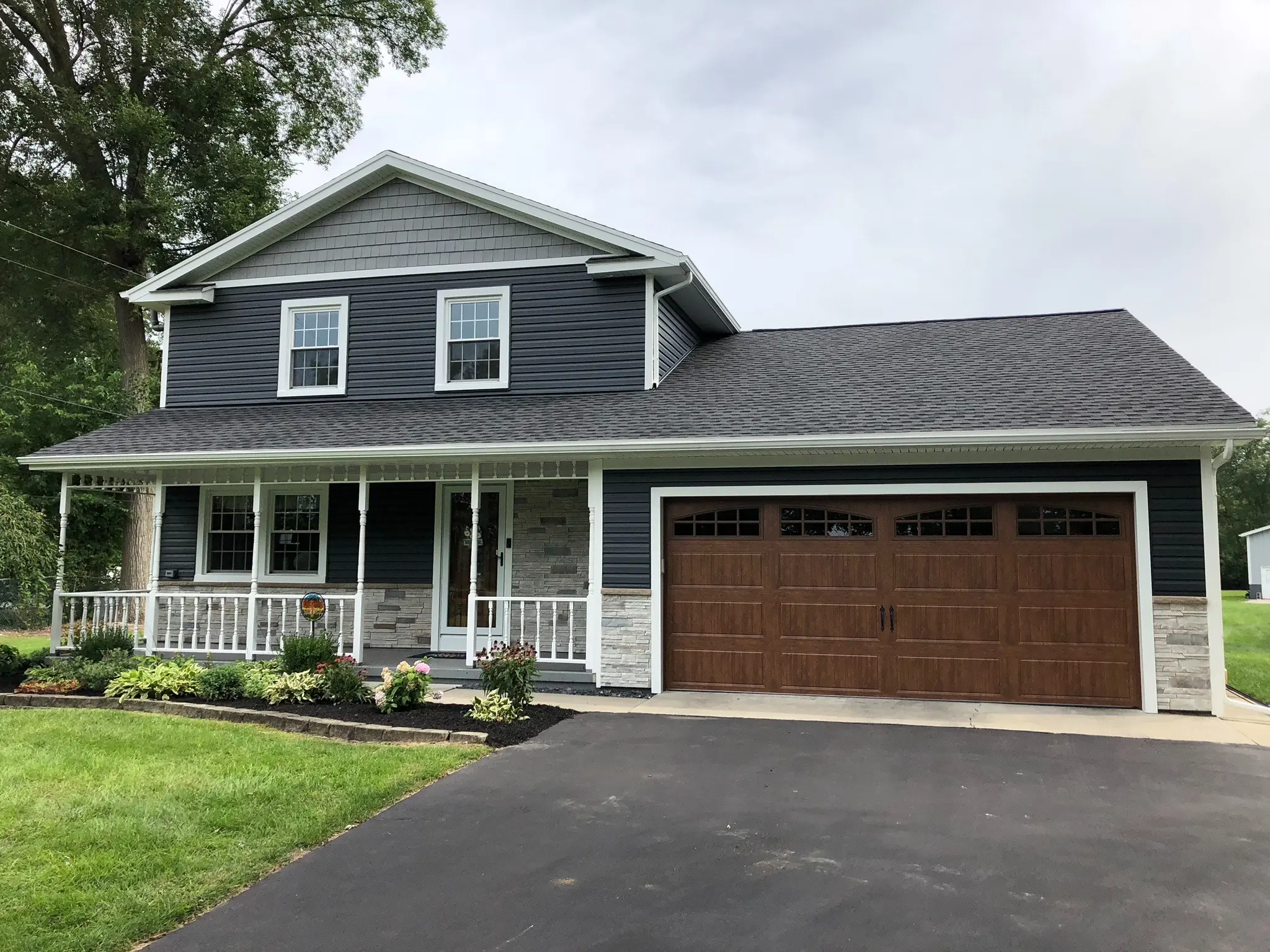 Completed asphalt shingle roof on a residential home
