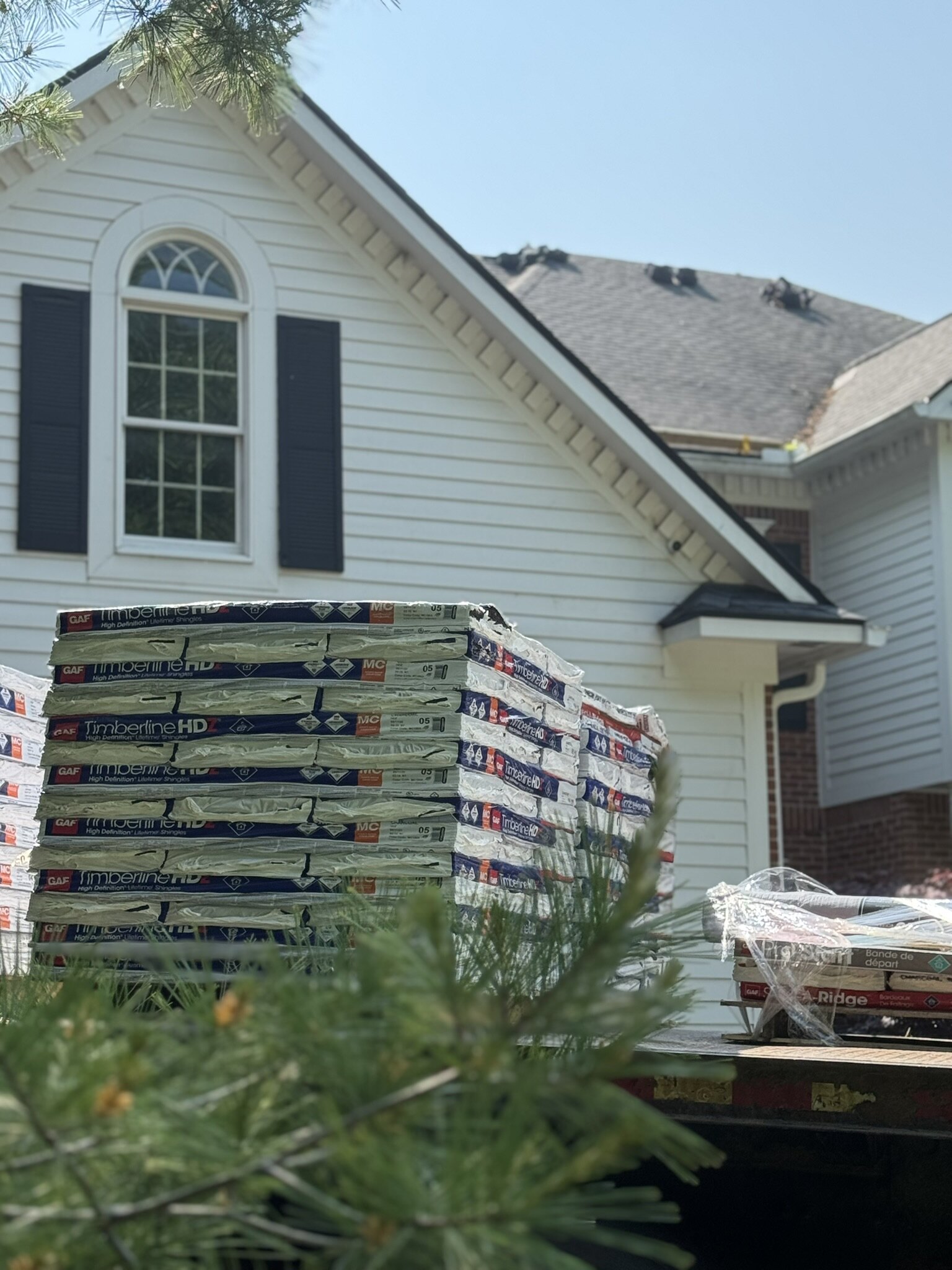GAF roofing materials staged for installation