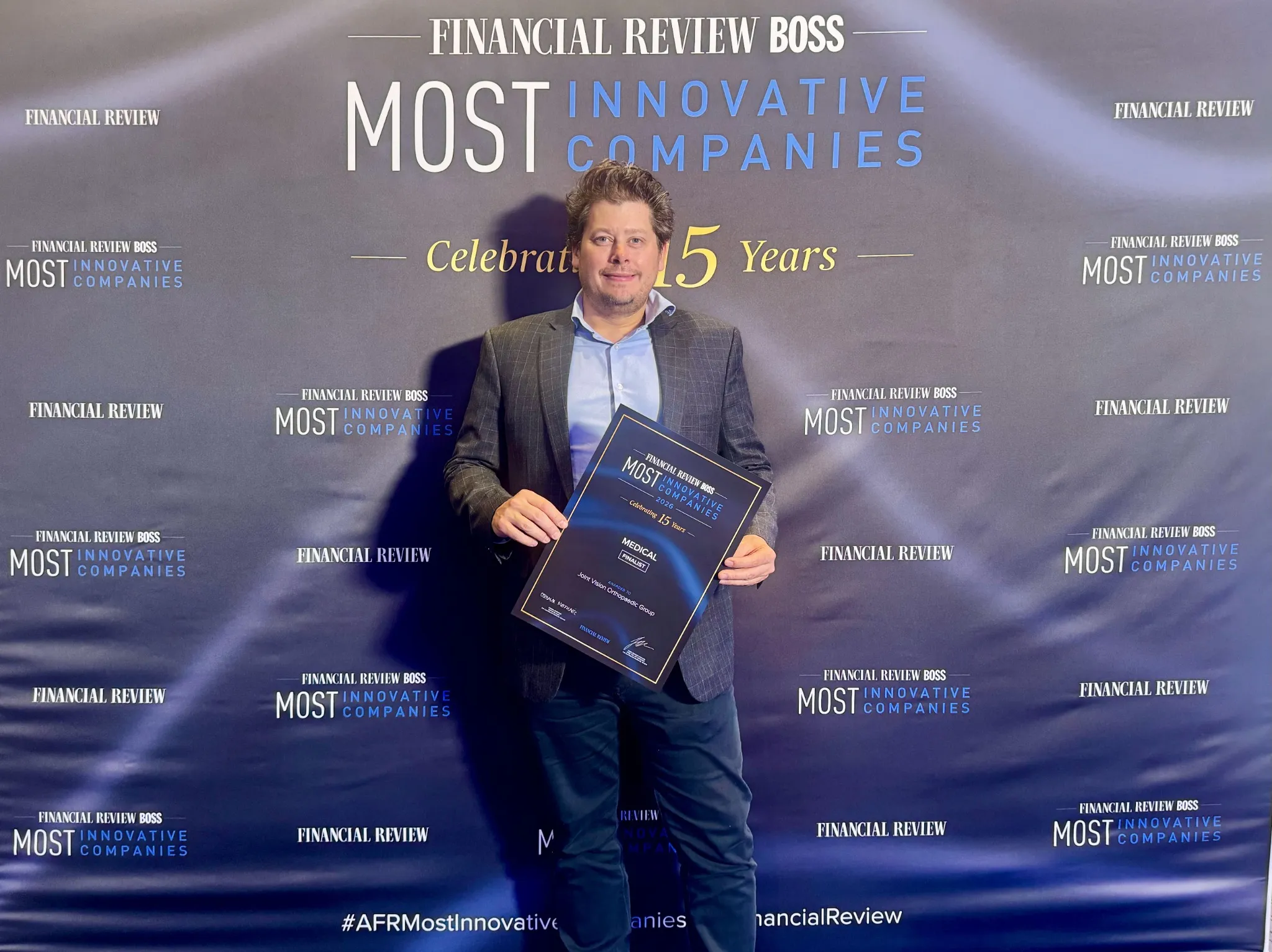 Joint Vision CEO Wynter Dares holding the 2026 AFR BOSS Most Innovative Companies Medical finalist certificate at the Sydney gala