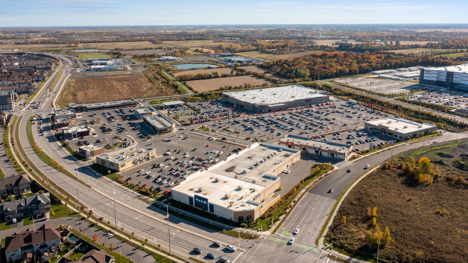 Aerial view of a multi-tenant retail plaza and parking lot
