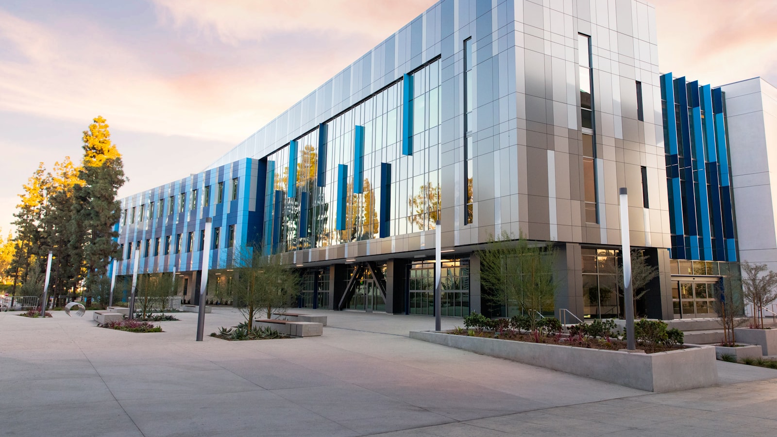 A low-rise office building surrounded by trees