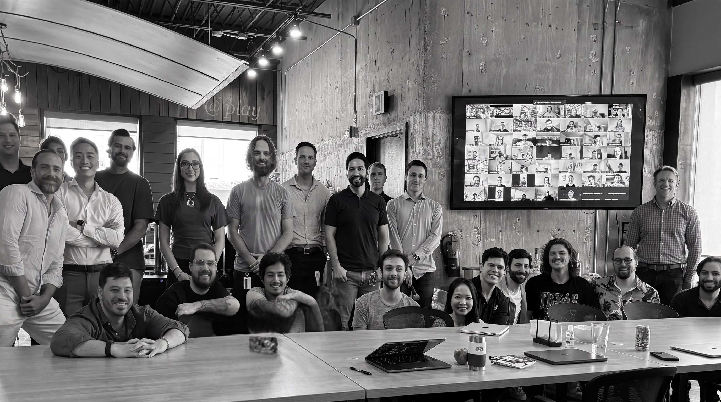 The Etude team gathered around the table in the office