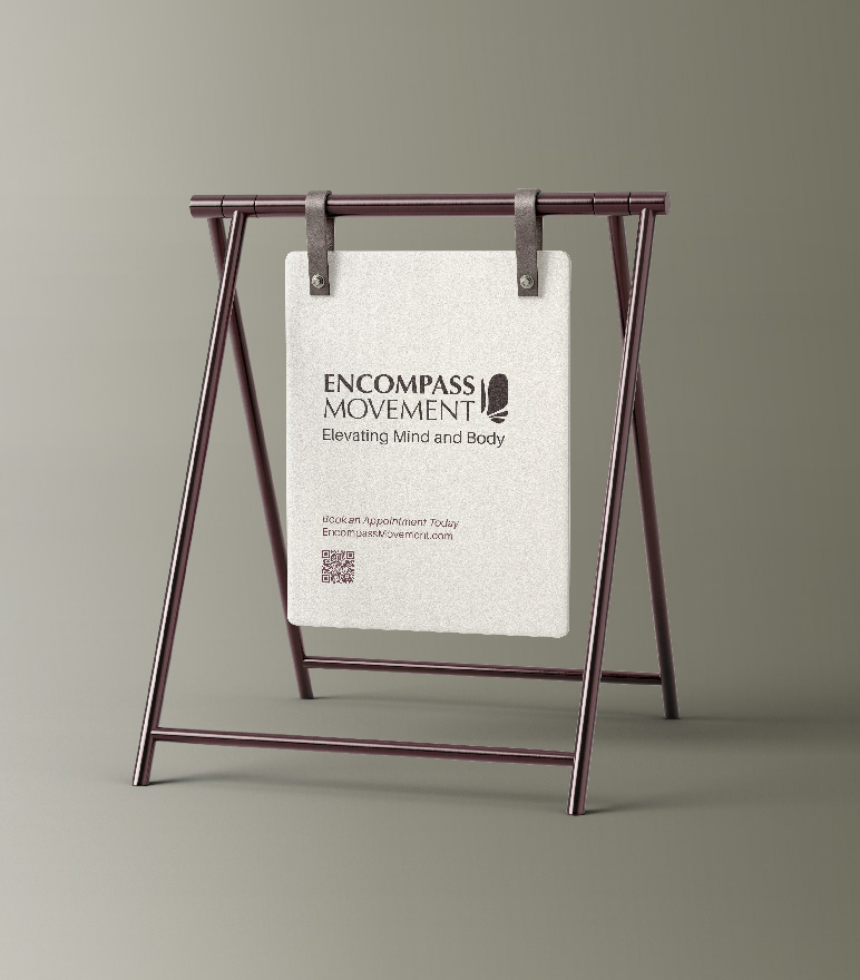 Encompass Movement sandwich board sign outside the studio