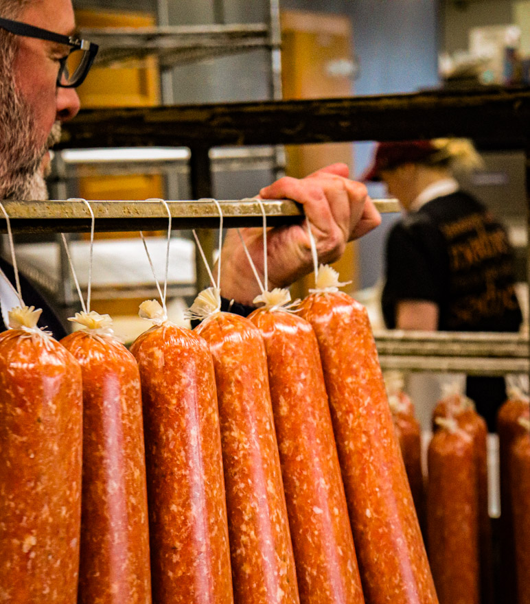 A rack of smoked sausages in the smokehouse at Archie's Meats, Starbuck