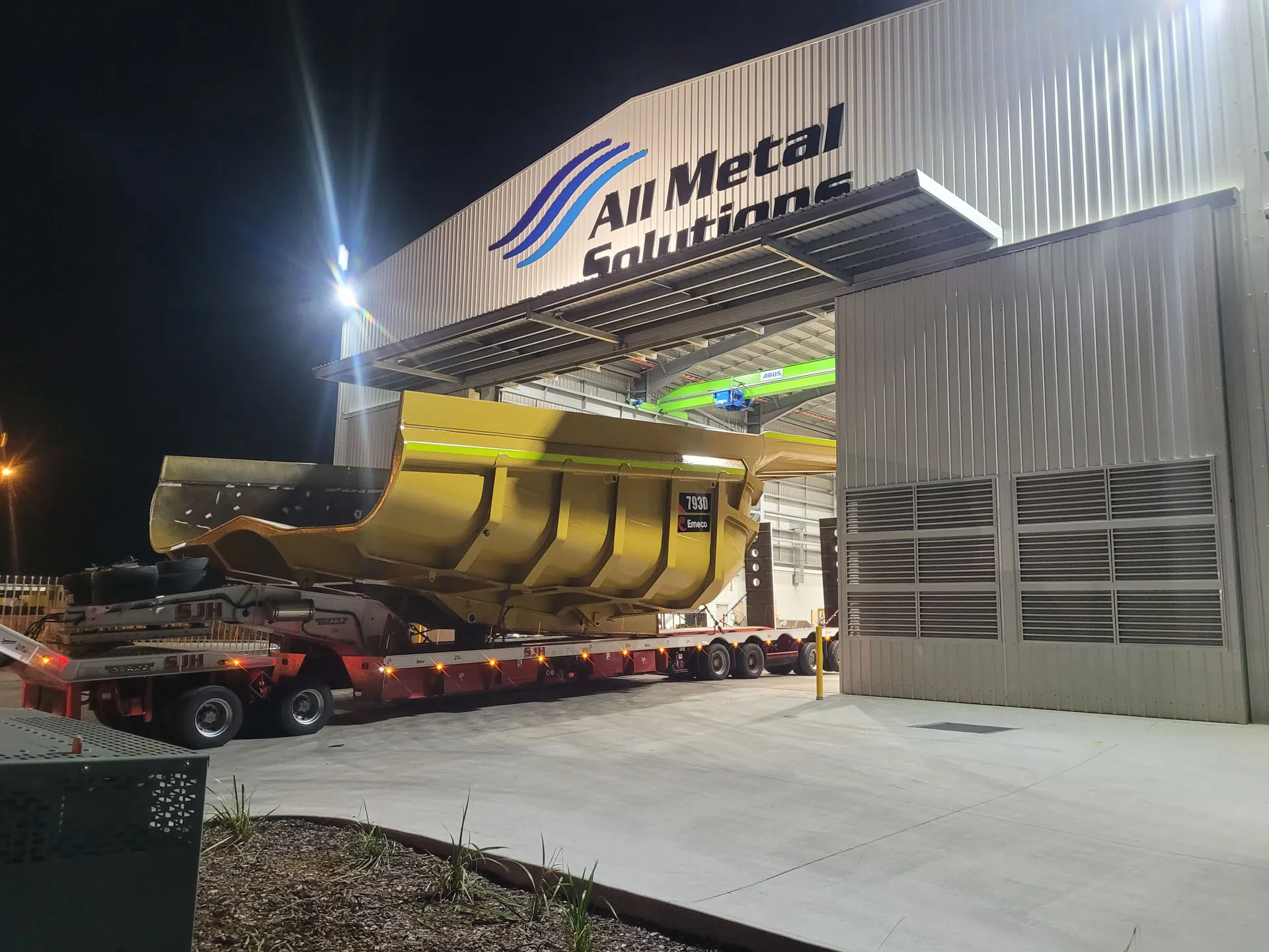 Haul truck body fabrication work at night