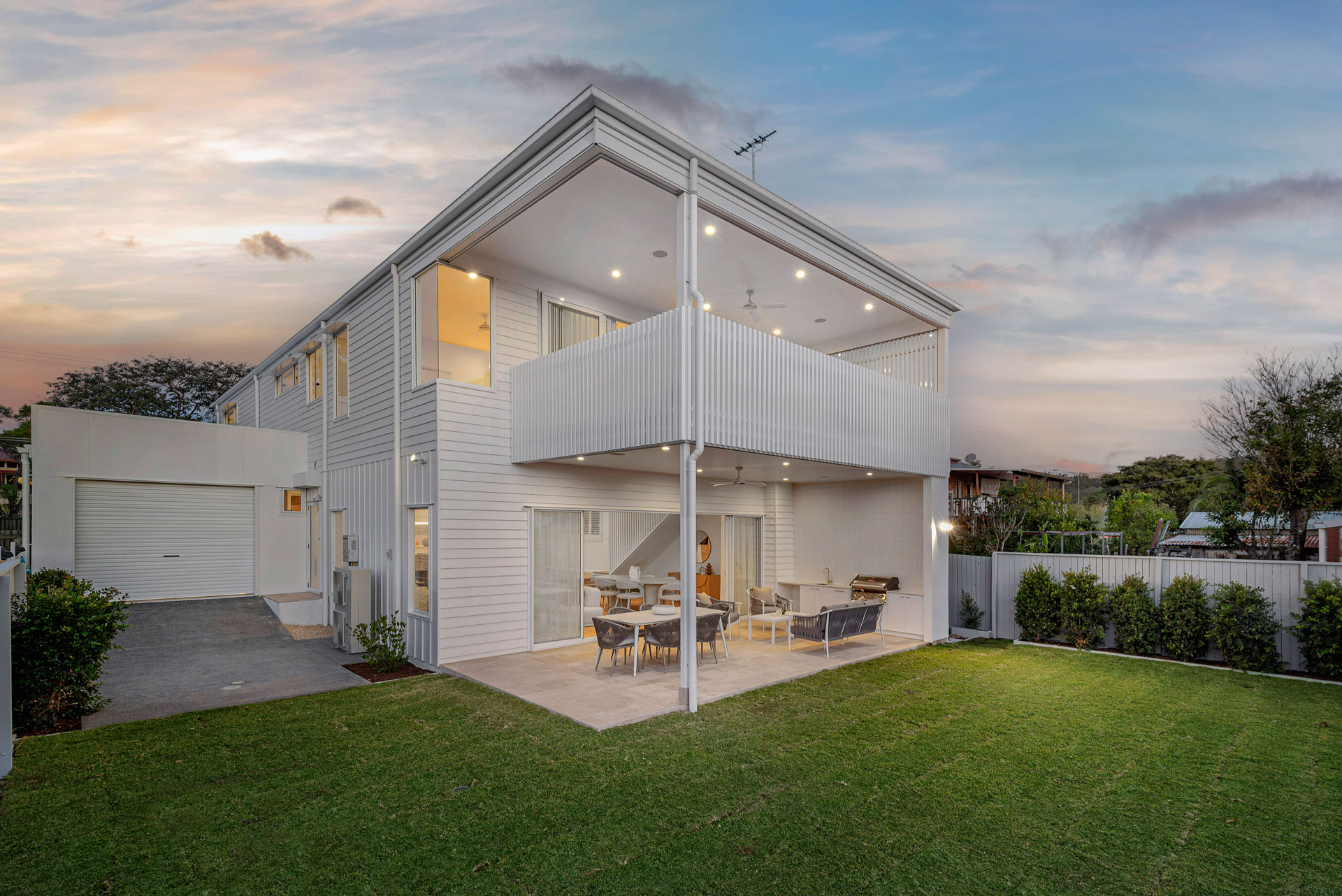 Rear elevation and lawn at dusk