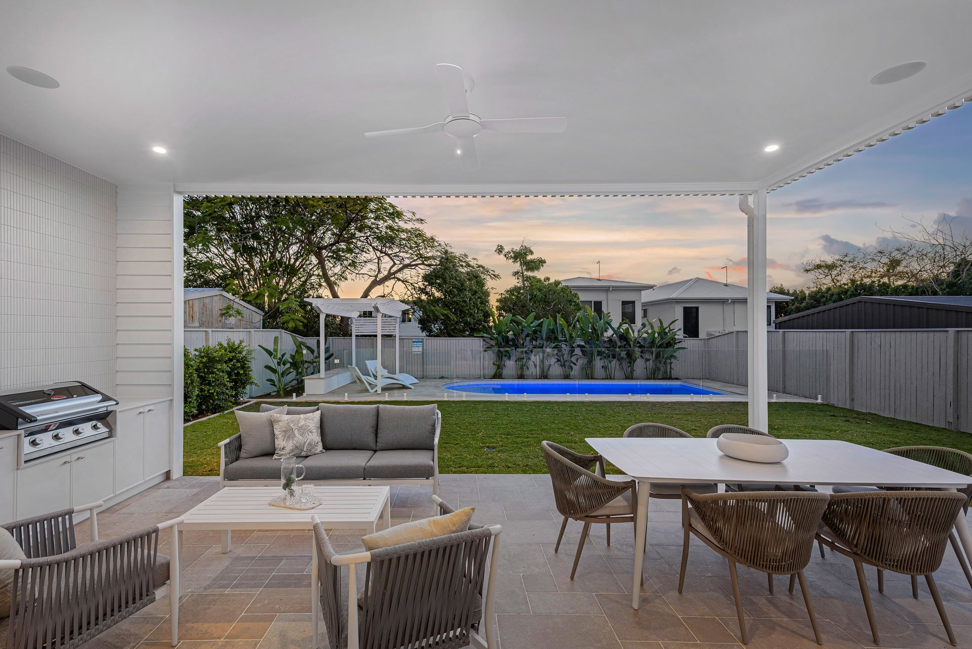 Covered outdoor living looking over the pool