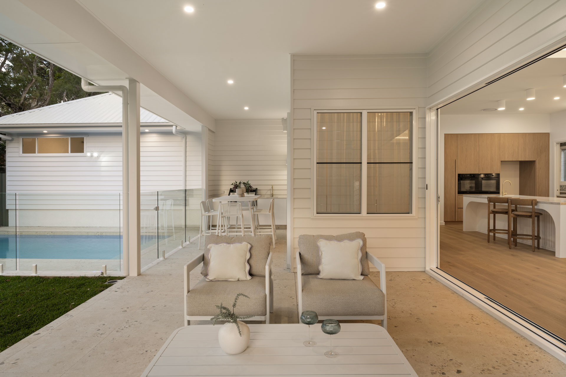 Covered outdoor living beside the pool