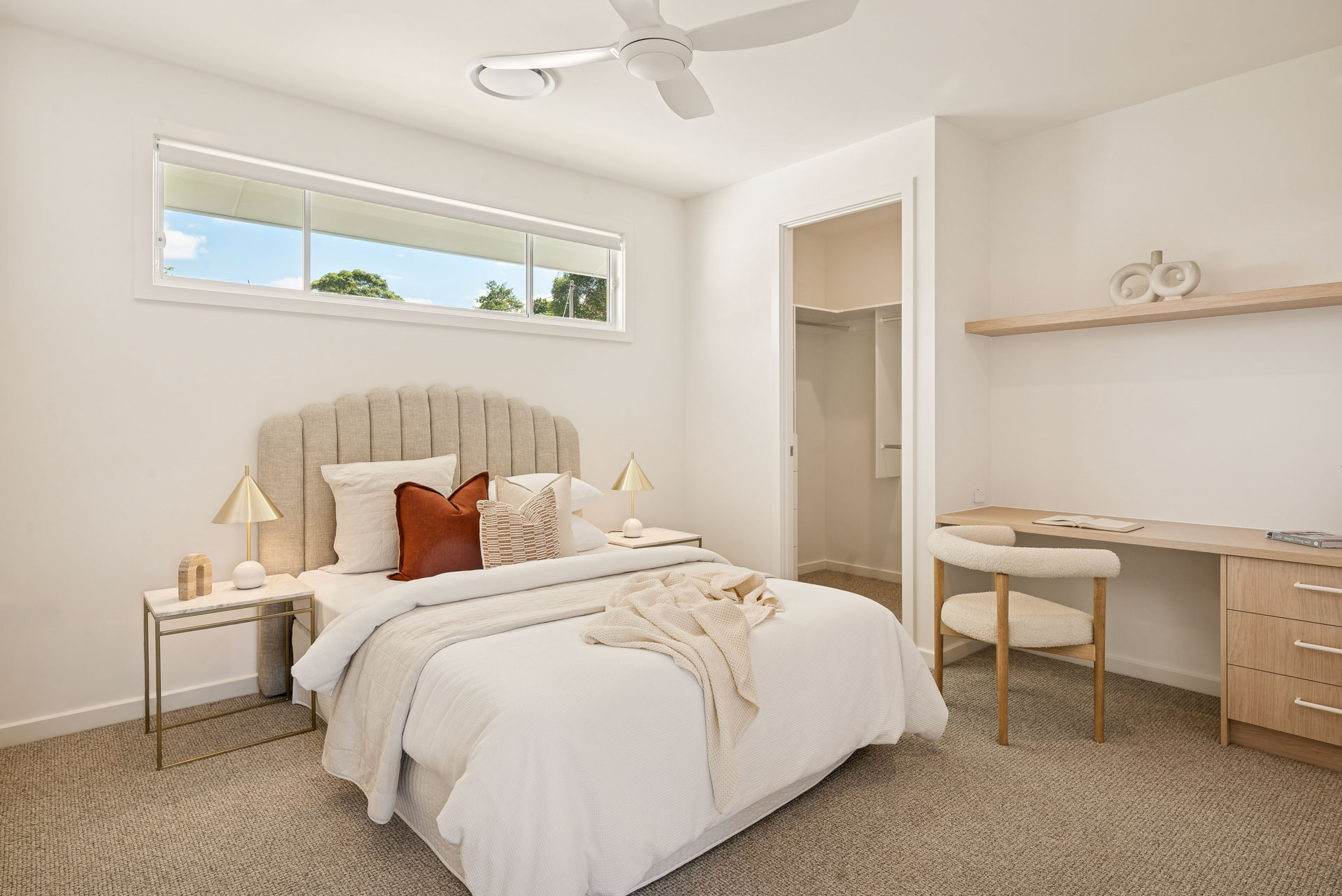 Bedroom with built-in desk and walk-in robe