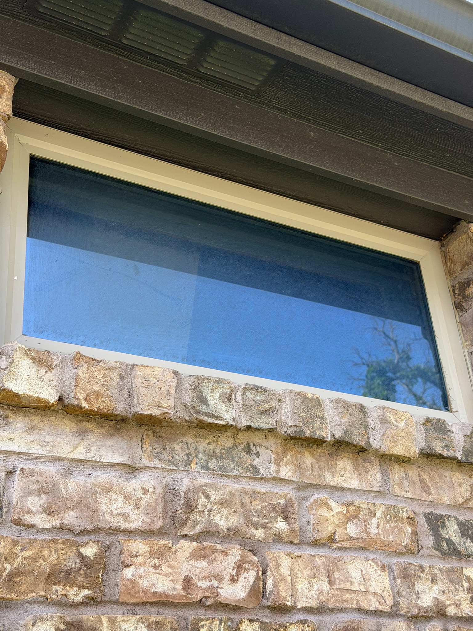 Clean exterior stone wall after pressure washing