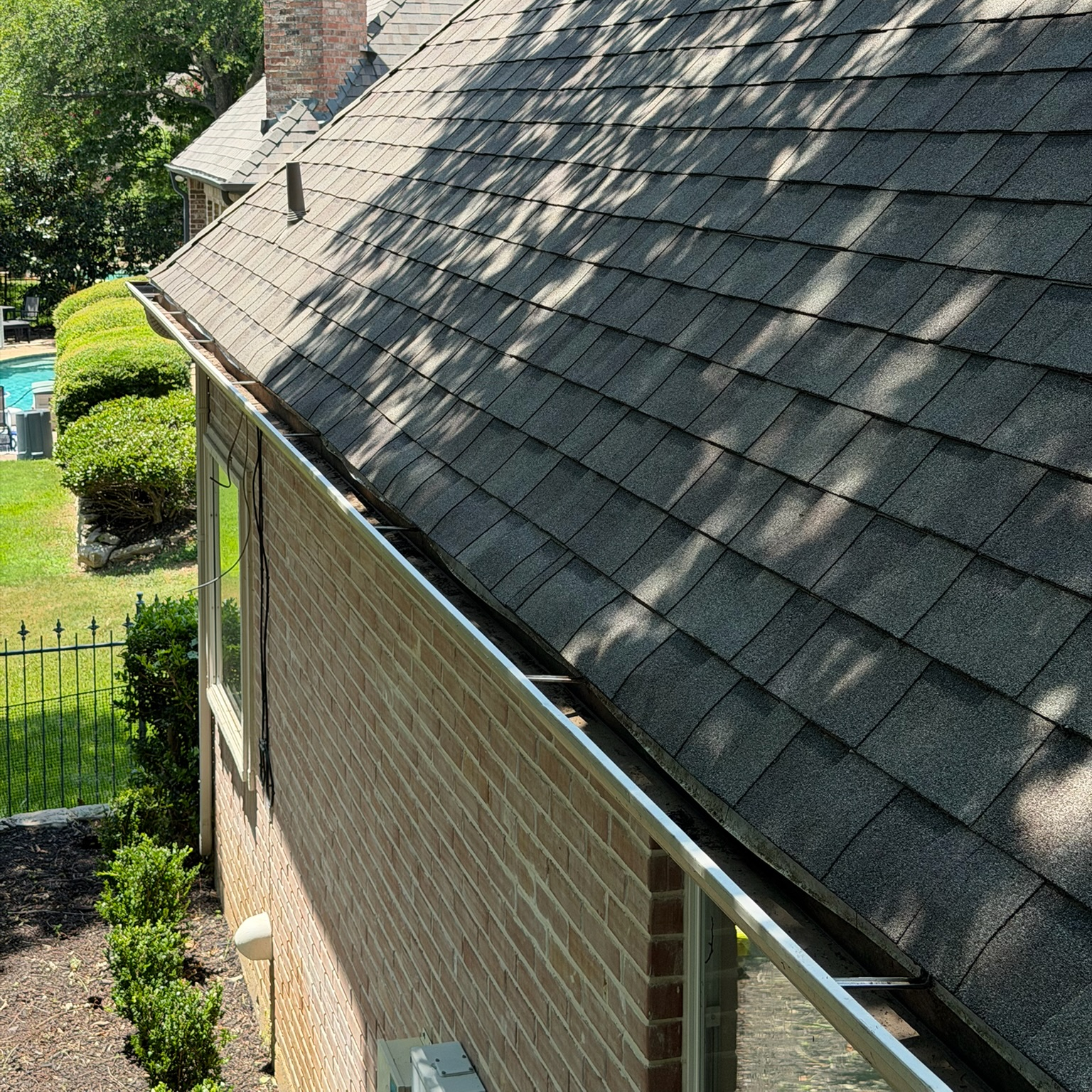 Clean exterior stone wall after pressure washing