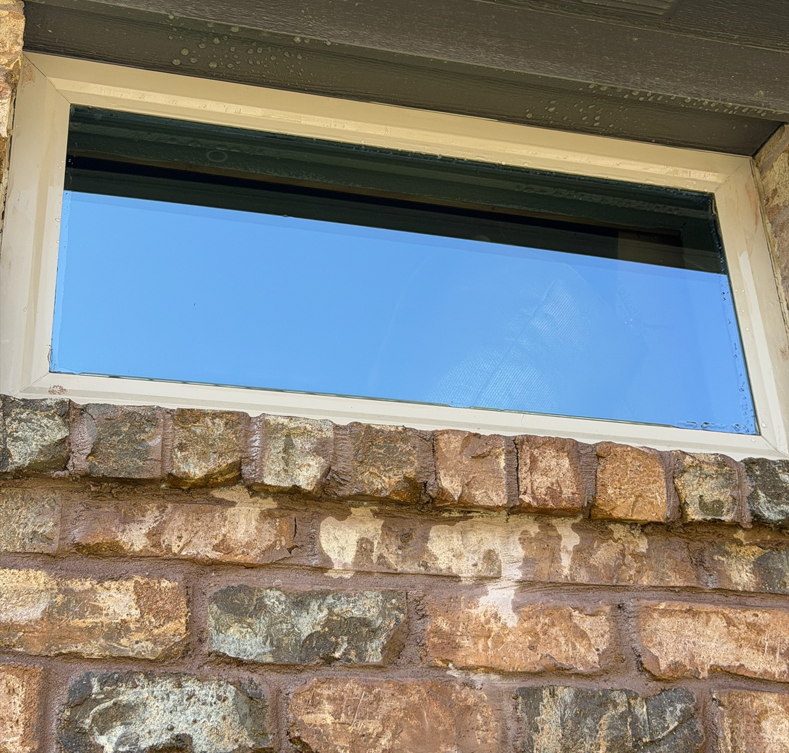 Clean exterior stone wall after pressure washing