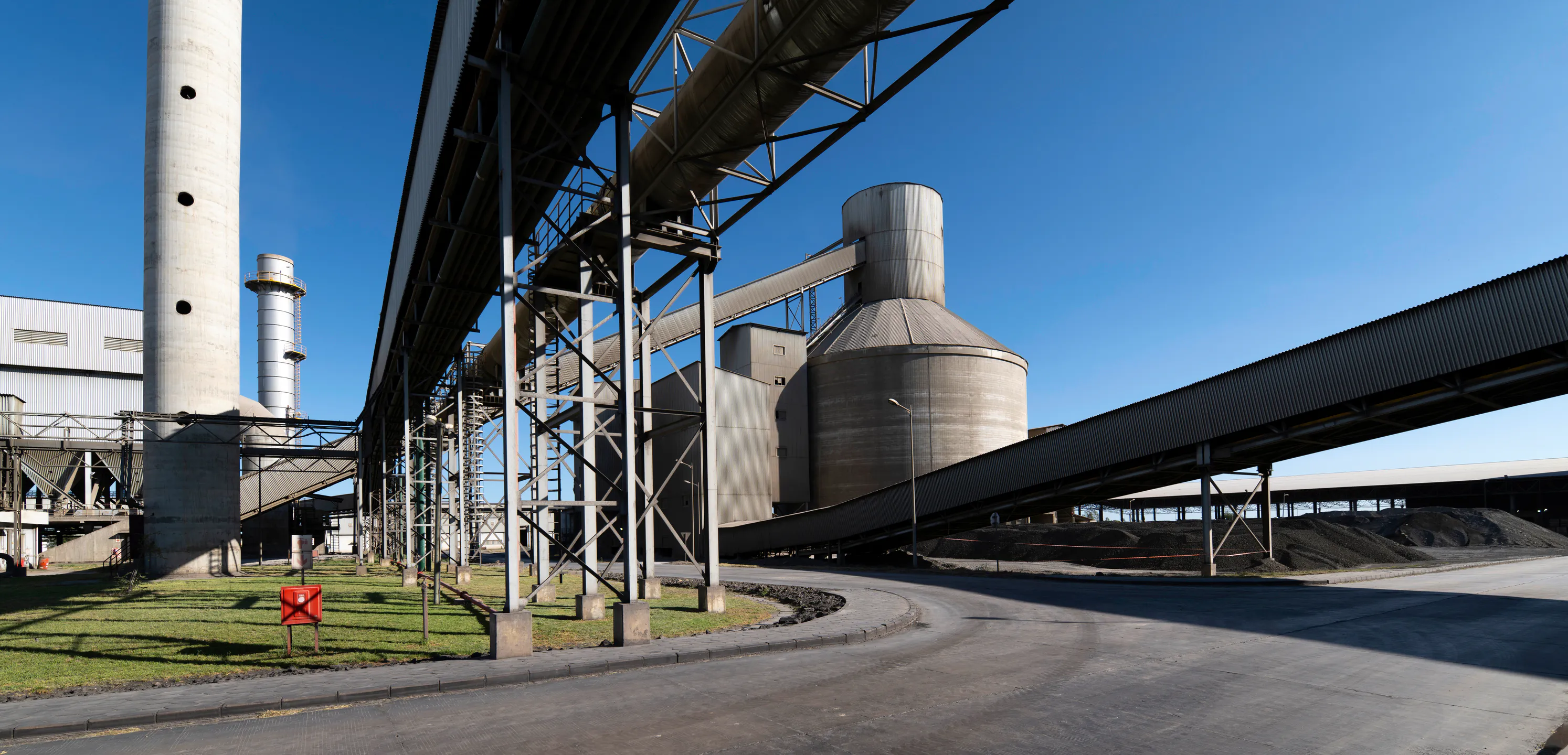 Conveyor gantry and storage silos at the Aganang clinker plant