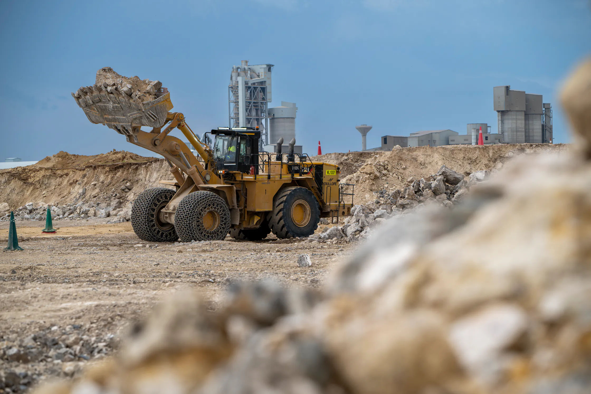 Front-end loader moving raw material at the Aganang quarry