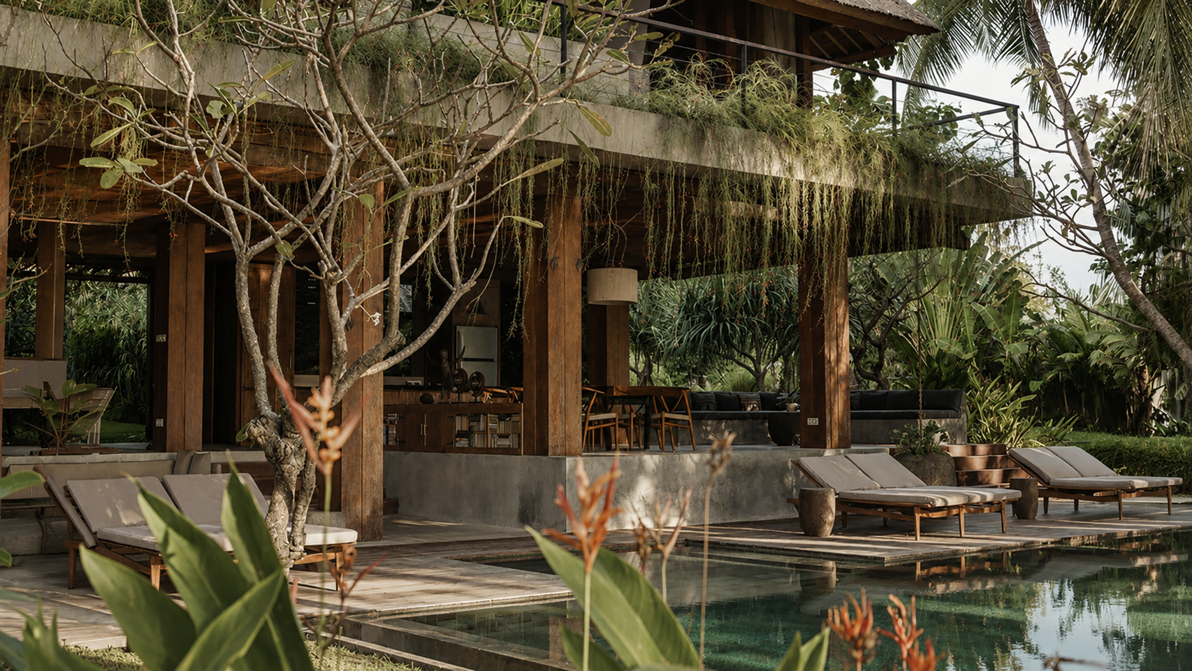 Open pavilion beside the pool with frangipani trees