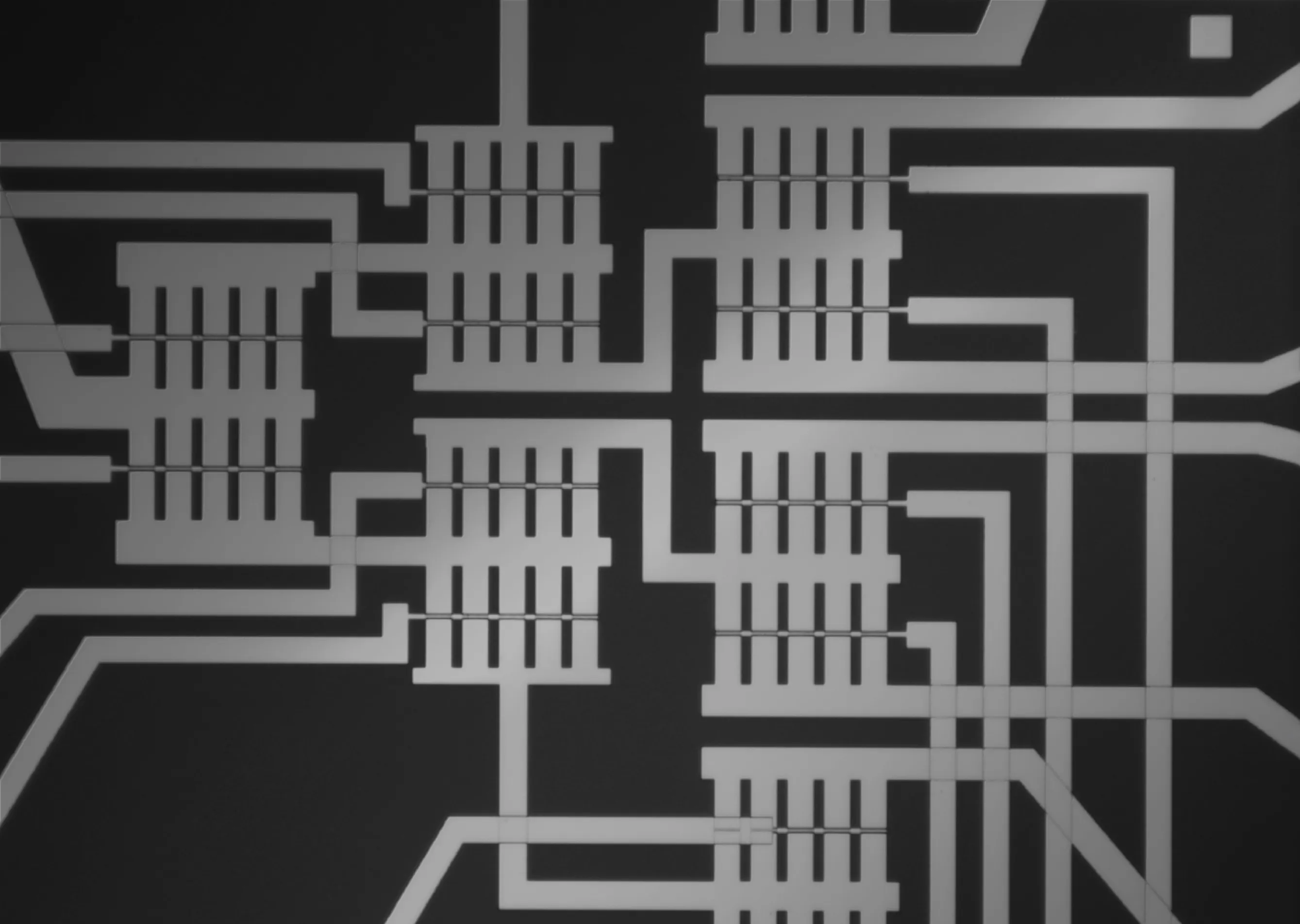 Micrograph of a superconducting transistor multiplexer circuit with signal routing lines