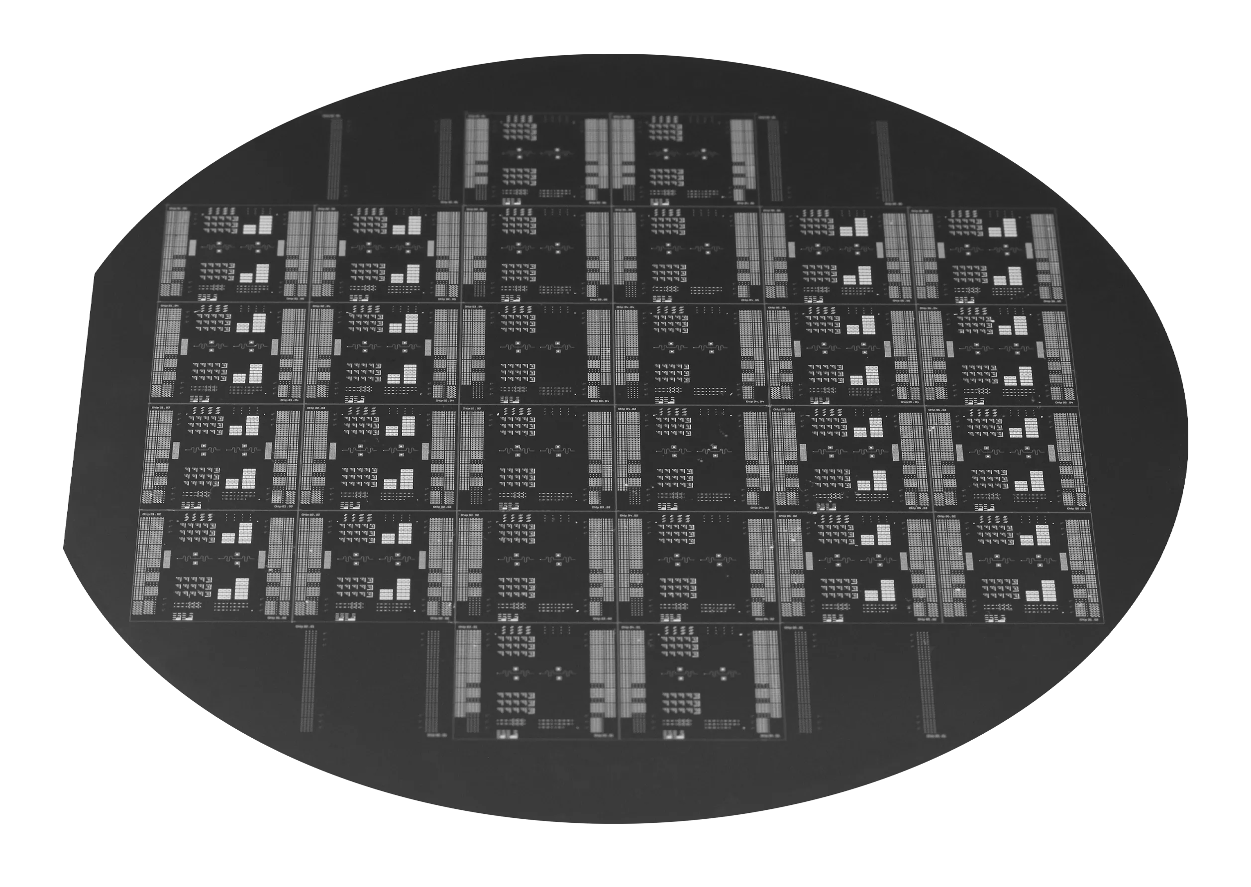 Silicon wafer patterned with rows of superconducting transistor chips